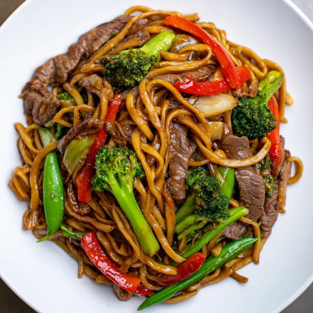 Close-up of Beef and Vegetable Stir Fry with Noodles featuring vibrant broccoli, carrots, and savory beef tossed in a wok.