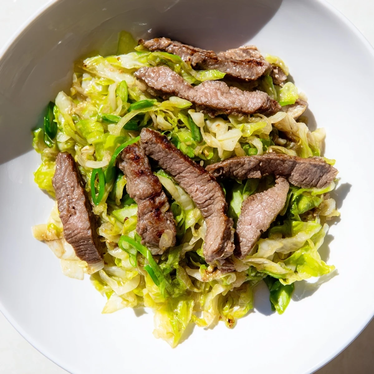 Tender beef strips and crisp cabbage in a savory low-carb sauce make this Keto Friendly Beef and Cabbage Stir Fry a vibrant skillet meal.