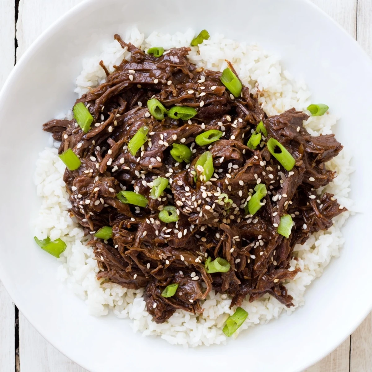 Slow cooker Crock Pot Korean Beef in a savory-sweet sauce with steamed broccoli.