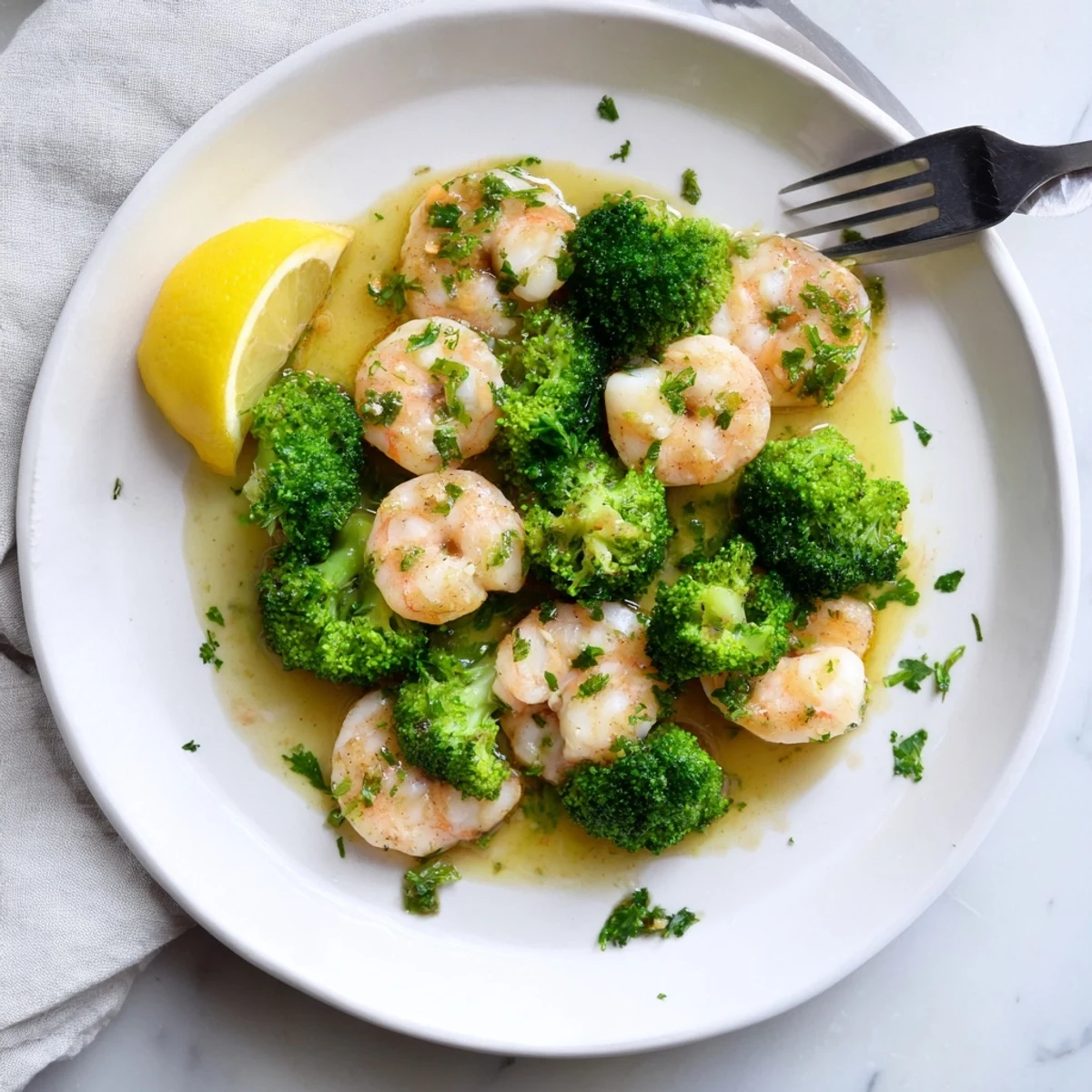 Tender shrimp and roasted broccoli tossed in a sweet and savory honey garlic butter sauce, served warm over fluffy quinoa.