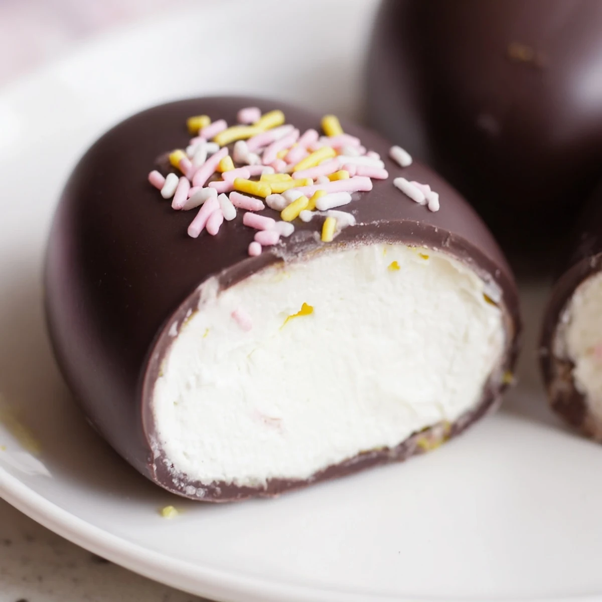 Rich chocolate coated Cool Whip Easter eggs with smooth cream cheese filling ready for spring dessert