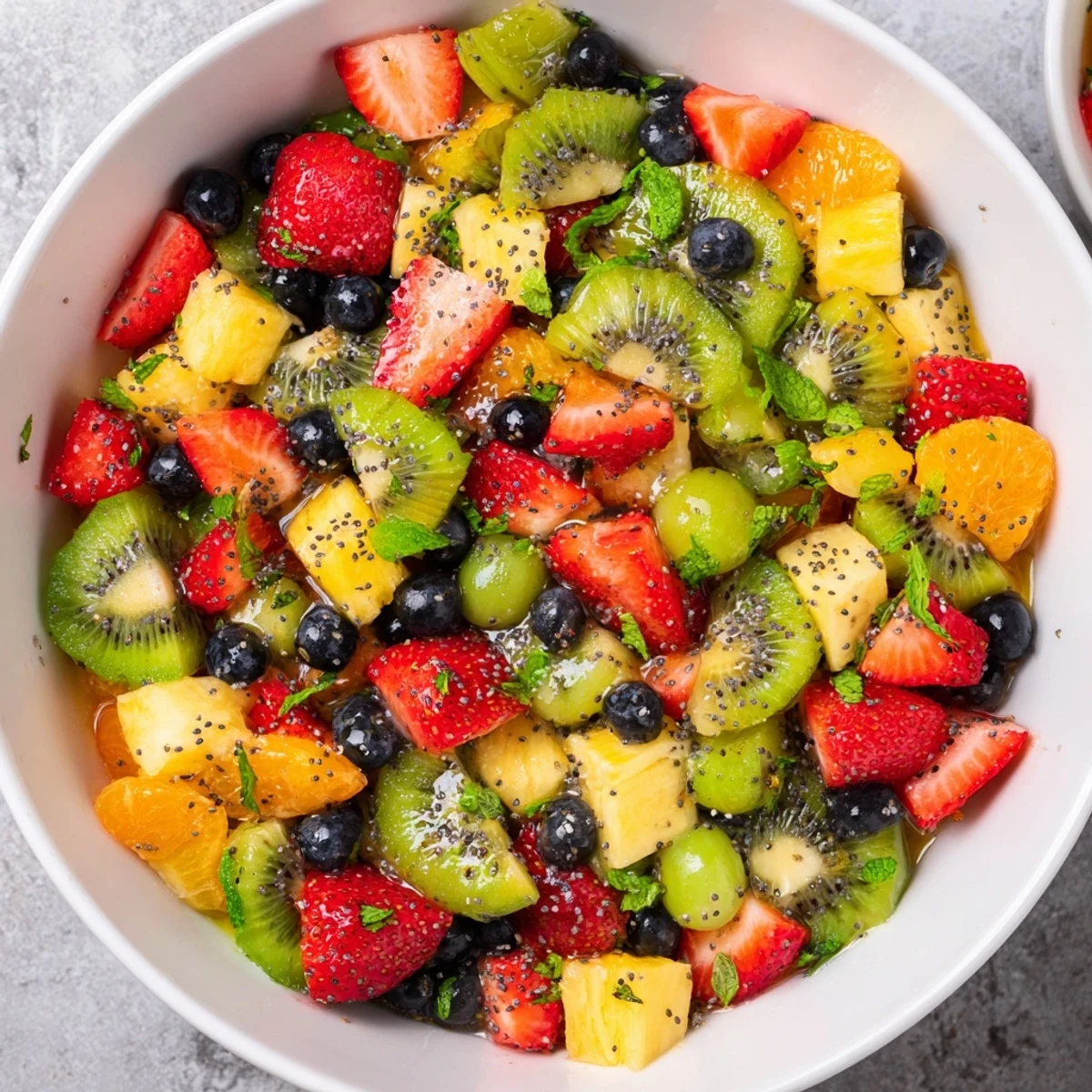 Vibrant spring Easter fruit salad with layered fresh grapes, strawberries, and kiwi slices ready to serve