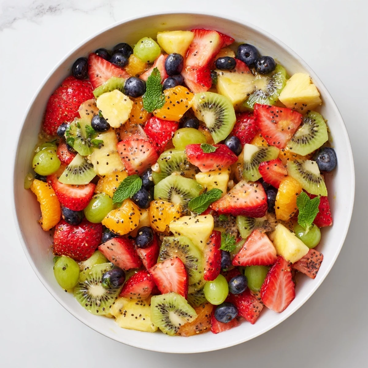 Refreshing Easter fruit salad featuring tropical pineapple, mandarin oranges, and honey lime dressing