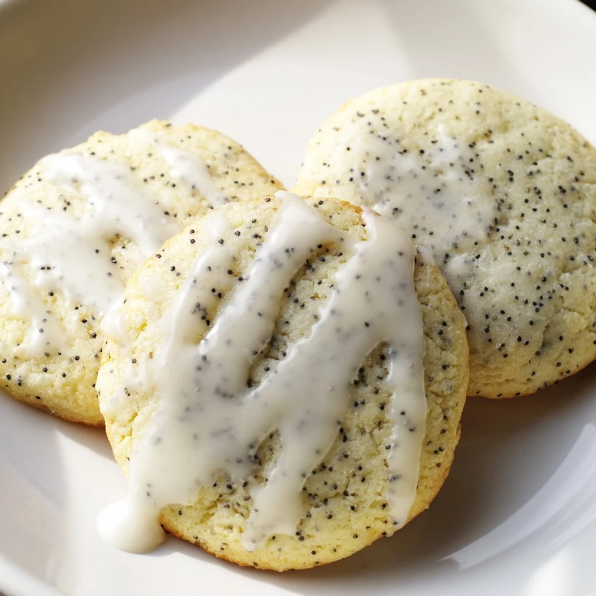 Soft lemon poppy seed cookies dotted with speckled seeds arranged on cooling wire rack