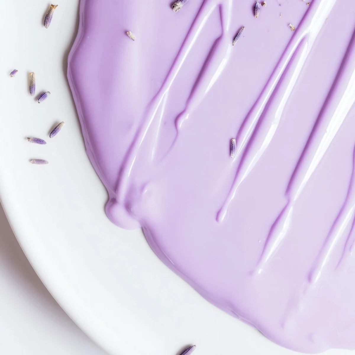 Smooth lavender glaze cascades down a golden pound cake in elegant white streams