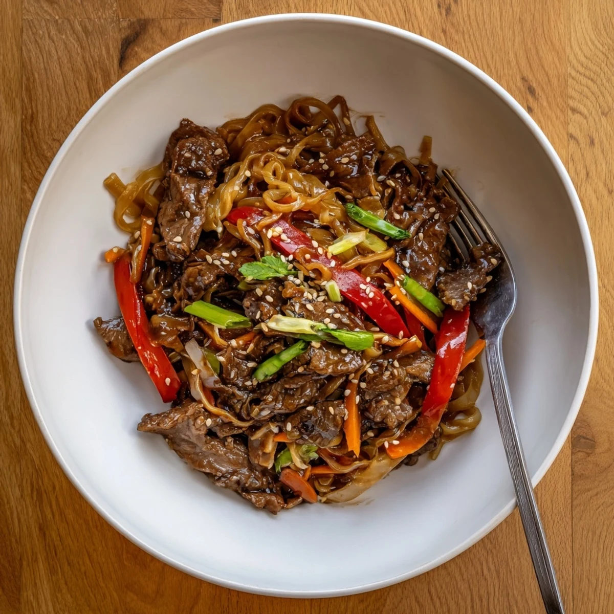 Warm Sticky Beef Noodles served for weeknight dinner, chewy strands and hoisin aroma