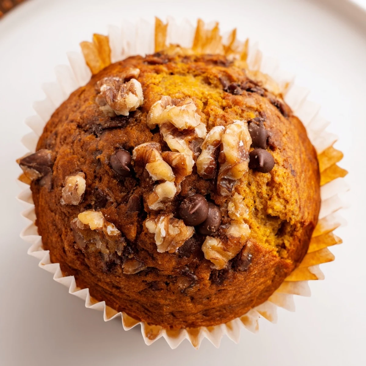 Pumpkin Banana Muffins steaming on a wire rack, spiced aroma wafting  