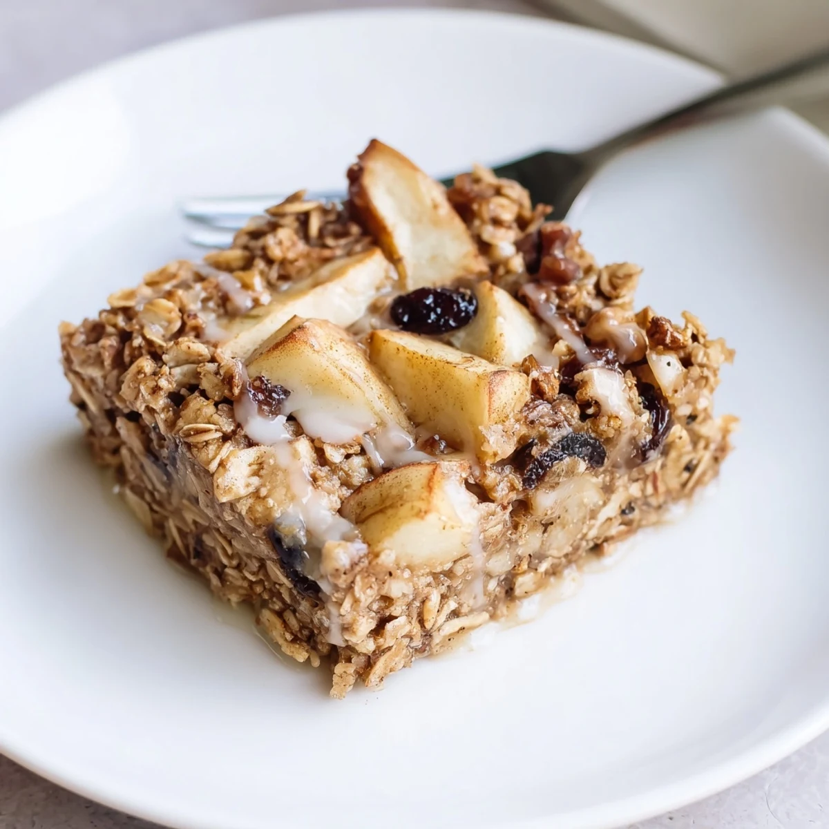 Delicious Apple Cinnamon Oatmeal Bake Recipe For Mornings warm and steaming, topped with maple