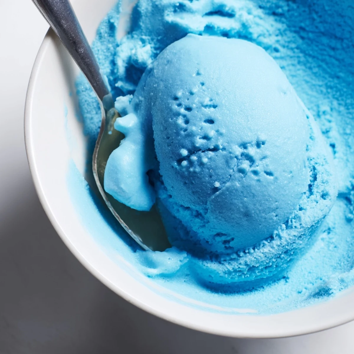 Creamy Blue Moon Ice Cream served in a bowl with colorful sprinkles